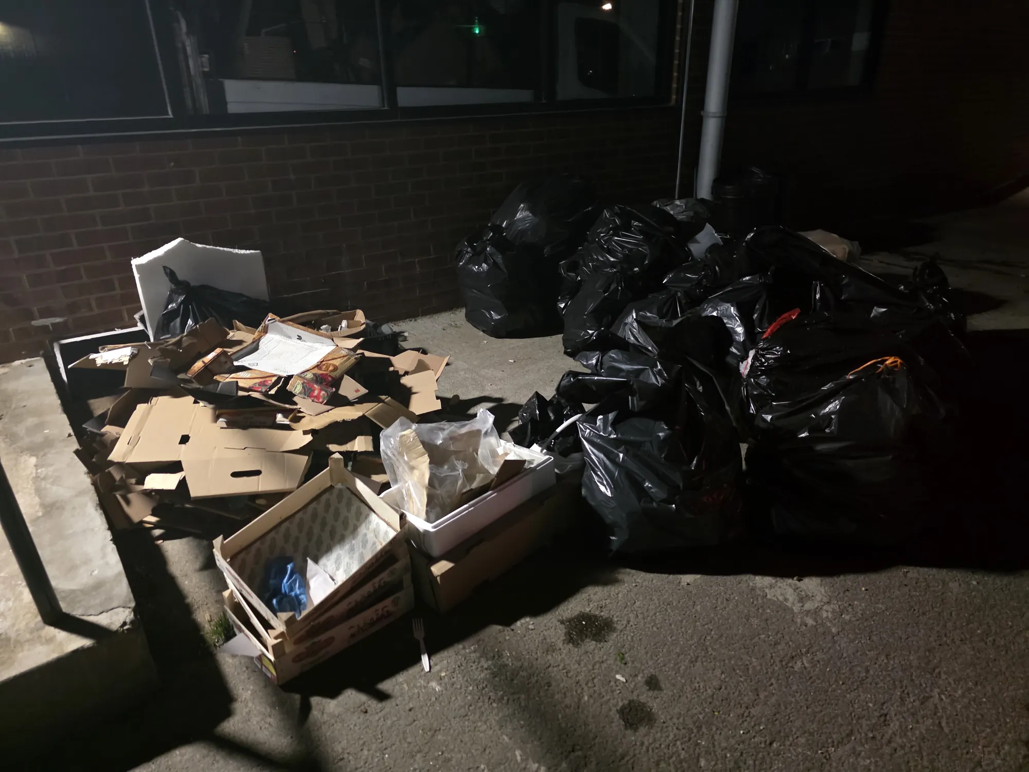 Waste bagged up after a location wrap at night